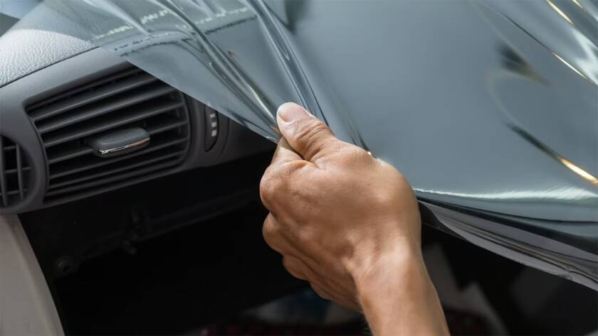 Wittmann Detailing in Springfield Missouri removing automotive tint from a windshield