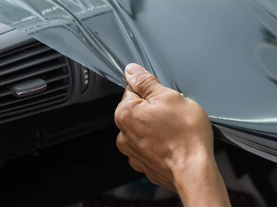 Wittmann Detailing in Springfield Missouri removing automotive tint from a windshield